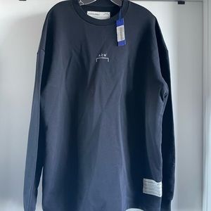 Black pullover by British street culture brand, A-Cold-Wall. Size medium.
